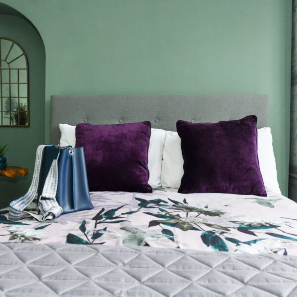 Cosy-bedroom-interior-with-sage-green walls-plush-bed-and-warm-ambient-lighting-emma-martin-interiors-nottingham