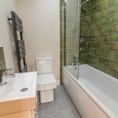 Bathroom design with green tiles